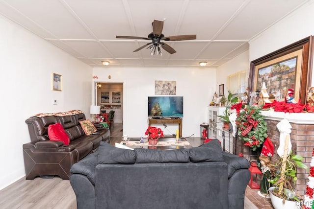 living room with light hardwood / wood-style flooring and ceiling fan