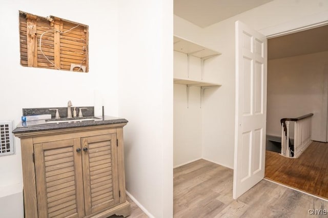 bathroom featuring sink and wood-type flooring