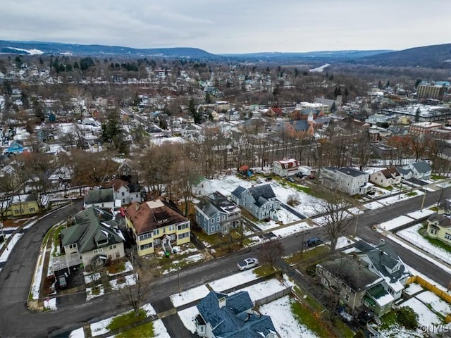 snowy aerial view with a mountain view