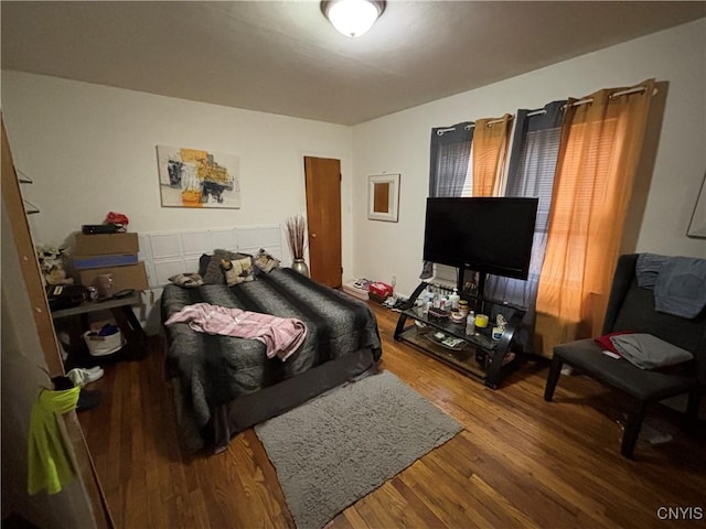 bedroom with hardwood / wood-style flooring