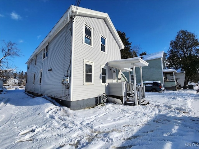 view of snow covered house