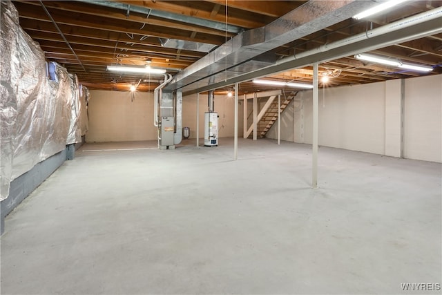 basement featuring heating unit and gas water heater