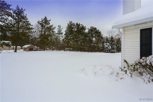 view of yard layered in snow