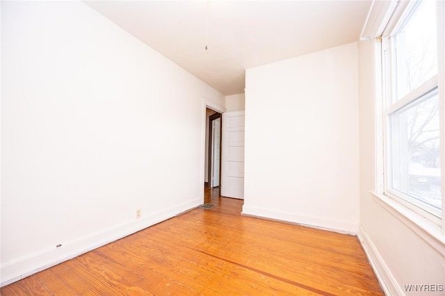 unfurnished room featuring wood-type flooring