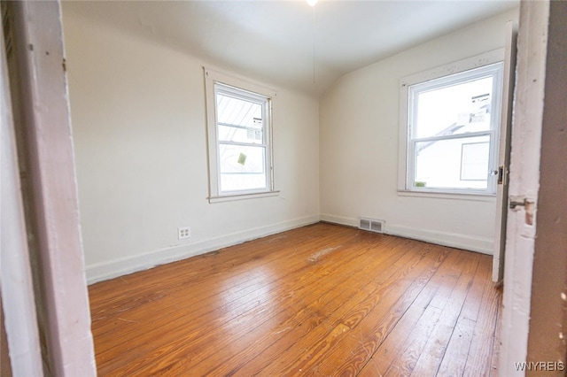 empty room with hardwood / wood-style floors