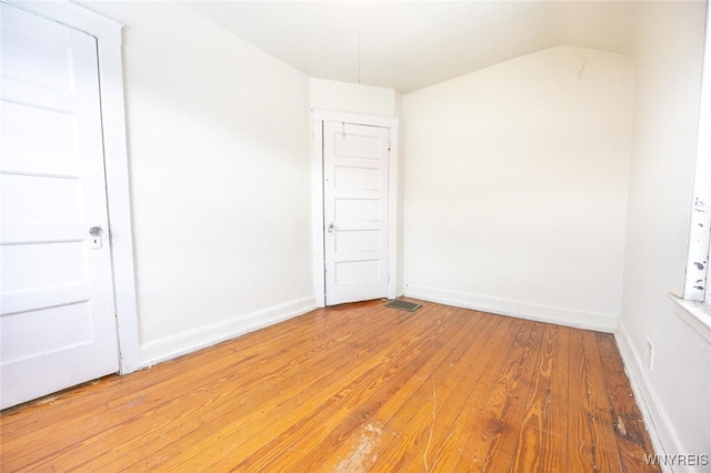 spare room featuring hardwood / wood-style floors