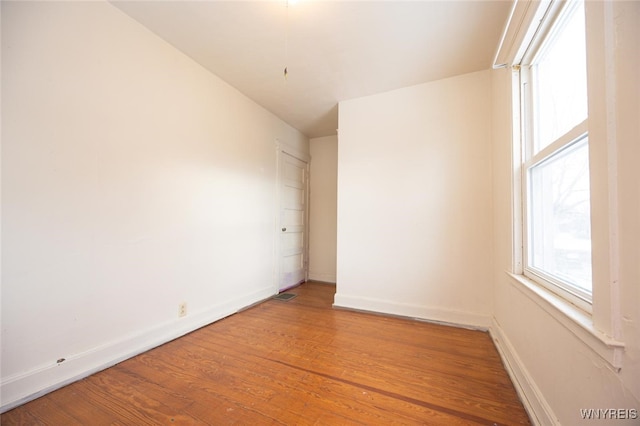 spare room featuring hardwood / wood-style flooring