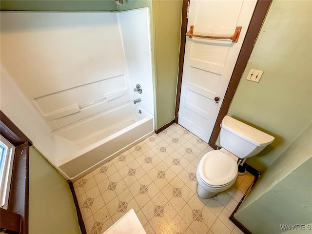 bathroom featuring shower / bath combination and toilet