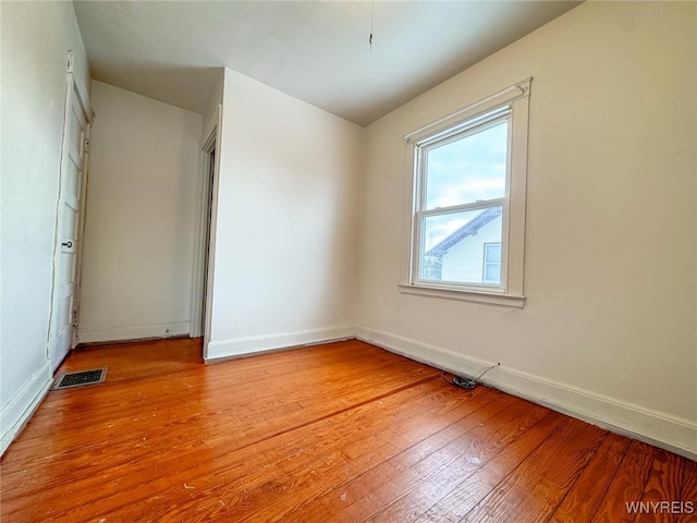 spare room with light hardwood / wood-style floors