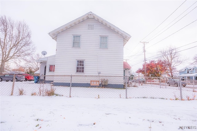 view of snow covered house