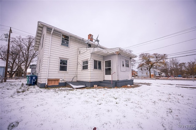 view of snow covered house