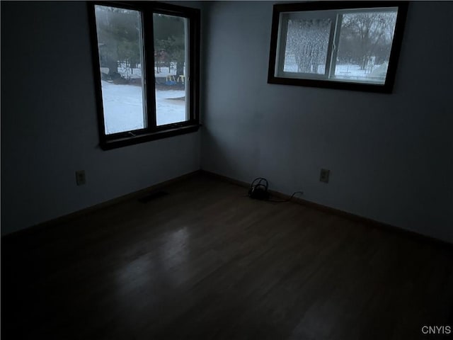 unfurnished room with hardwood / wood-style floors