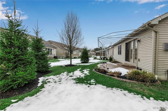 view of yard covered in snow