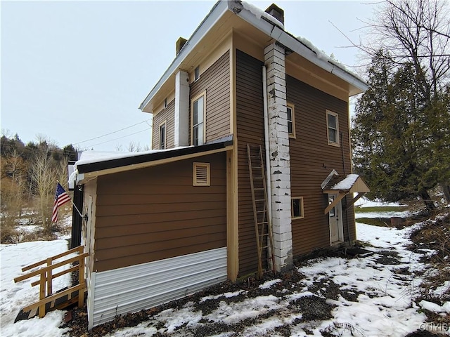 view of snow covered property