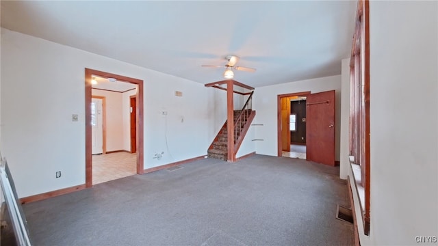 unfurnished living room featuring ceiling fan