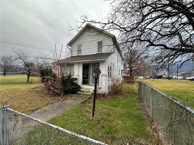 bungalow-style house with a front yard