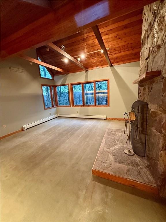 additional living space featuring beamed ceiling, wood ceiling, and a baseboard heating unit