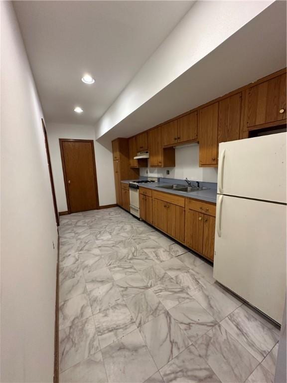 kitchen with white appliances and sink