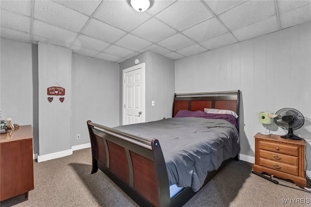 carpeted bedroom featuring a paneled ceiling