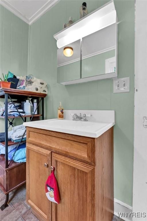 bathroom with crown molding and vanity