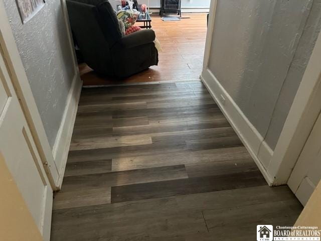 hallway featuring dark hardwood / wood-style floors