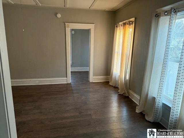 empty room featuring dark hardwood / wood-style floors