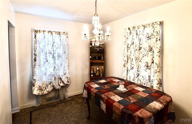 bedroom with a notable chandelier