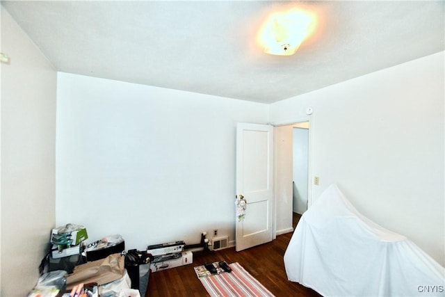 bedroom featuring dark hardwood / wood-style flooring