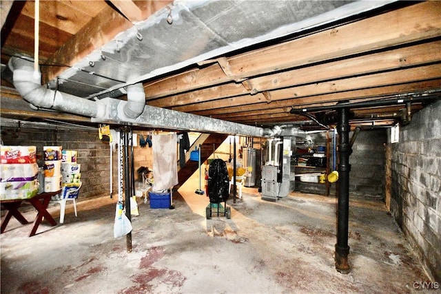 basement with heating unit and gas water heater