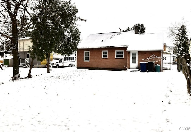 view of snow covered house