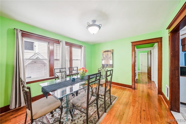 dining space featuring light hardwood / wood-style floors