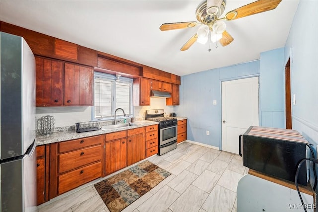 kitchen with ceiling fan, sink, and stainless steel appliances