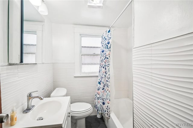 full bathroom featuring shower / bath combination with curtain, a healthy amount of sunlight, tile walls, and tile patterned flooring