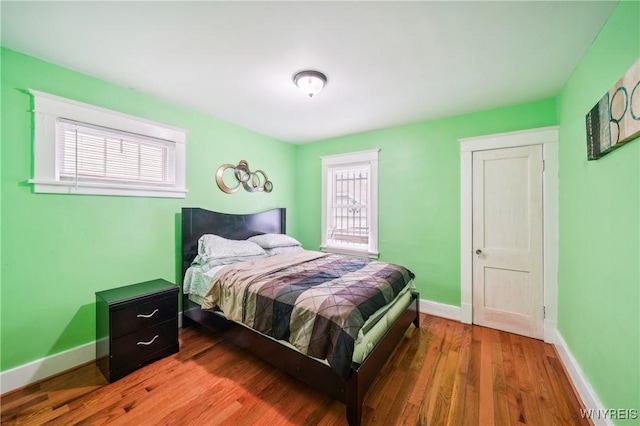 bedroom with hardwood / wood-style floors