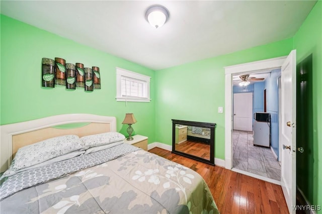 bedroom with hardwood / wood-style floors