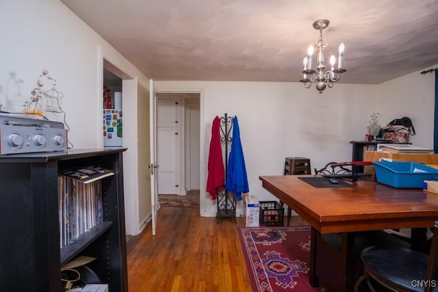 home office with a chandelier and wood-type flooring