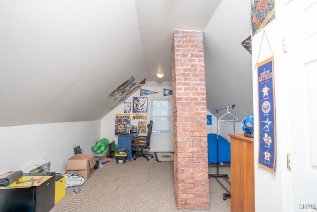 rec room with carpet floors and vaulted ceiling