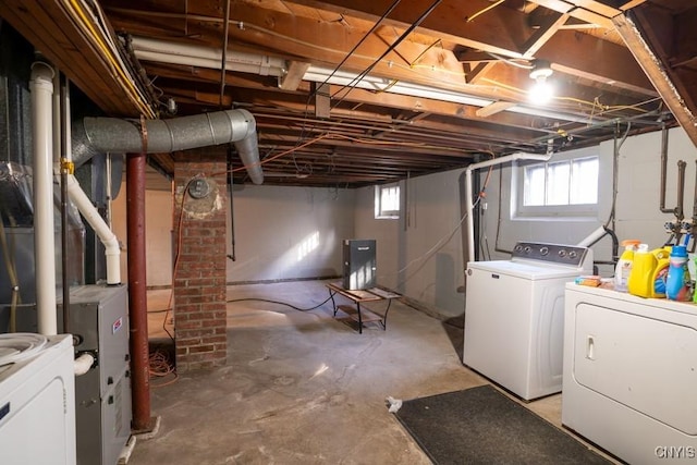 basement with washing machine and clothes dryer