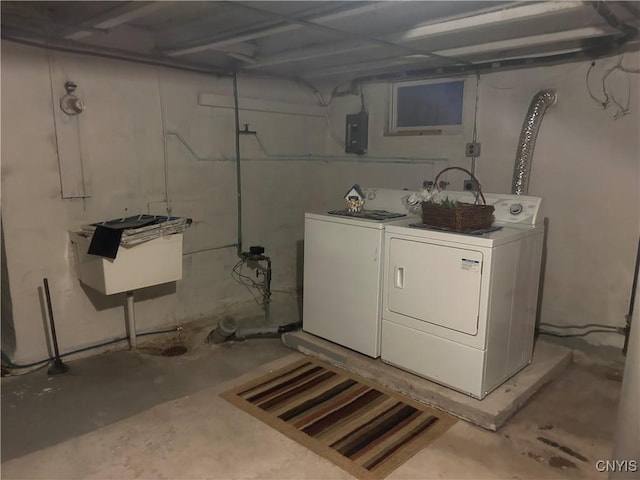 laundry room with washer and clothes dryer and electric panel