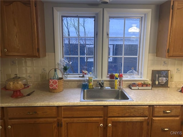 kitchen with decorative backsplash and sink