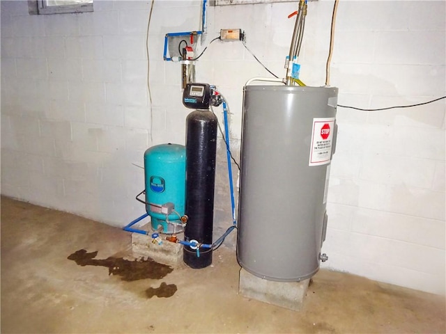 utility room featuring water heater