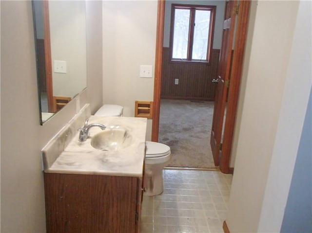 bathroom with vanity and toilet