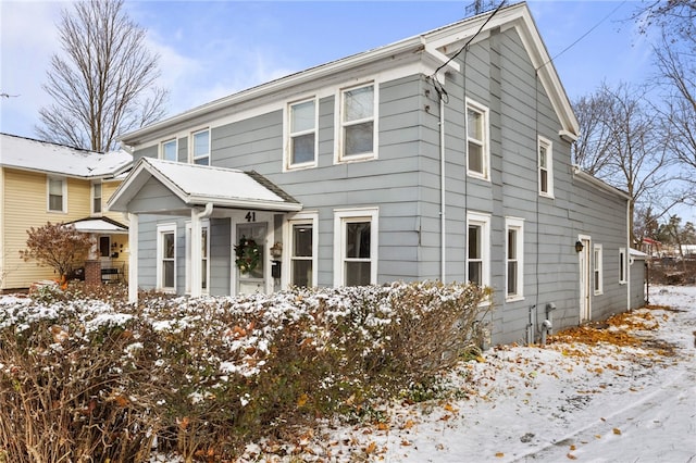 view of snow covered property