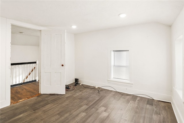 unfurnished room featuring dark hardwood / wood-style flooring