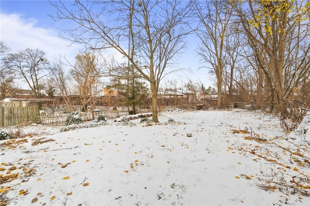 view of yard layered in snow