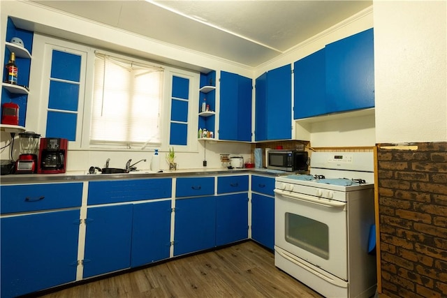 kitchen with brick wall, sink, blue cabinetry, white range with gas stovetop, and dark hardwood / wood-style floors