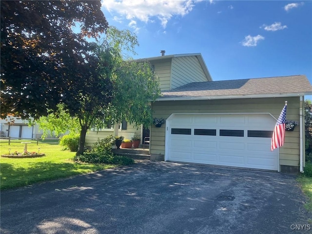 view of home's exterior with a yard and a garage