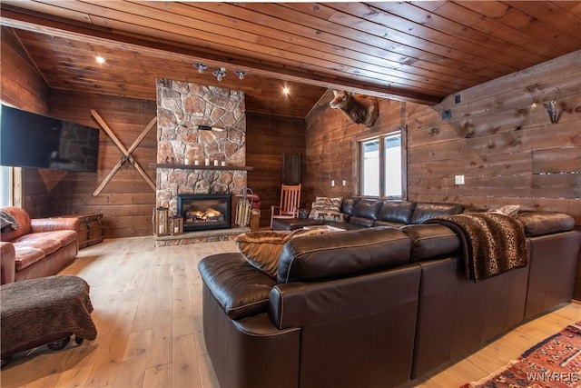 living room featuring lofted ceiling, wood ceiling, wood walls, and wood-type flooring