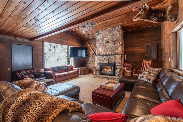 living area with lofted ceiling, wooden walls, wood finished floors, and wood ceiling