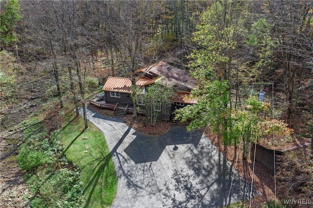 birds eye view of property with a wooded view